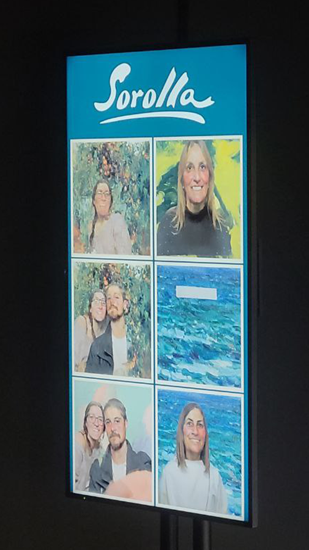 Screen with portraits of the audience